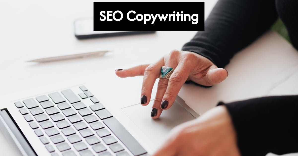 Modern desk with laptop and SEO copywriter working