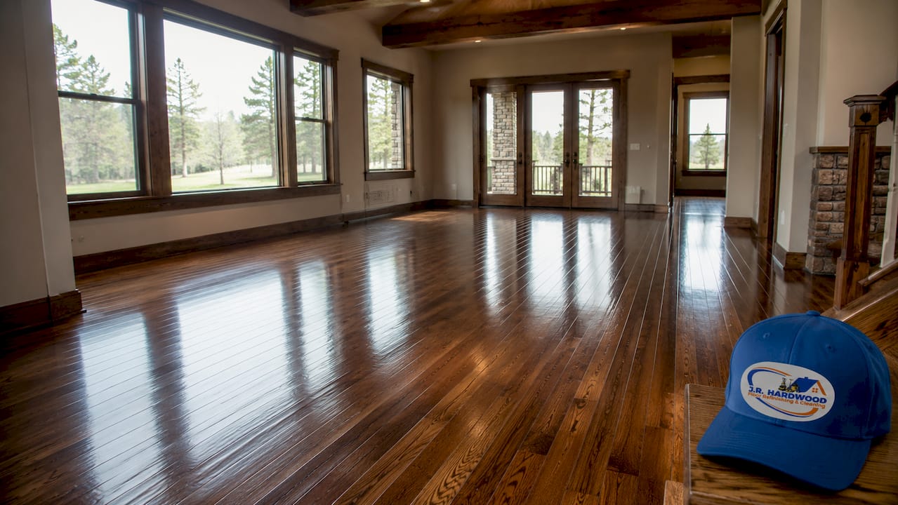 Brightly lit refinished hardwood floor with warm tones