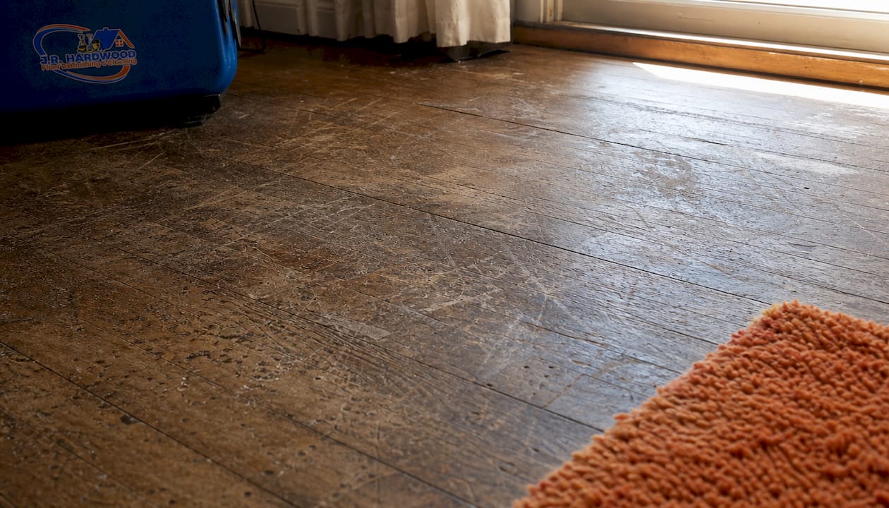 Close-up of worn scratched hardwood floor surface
