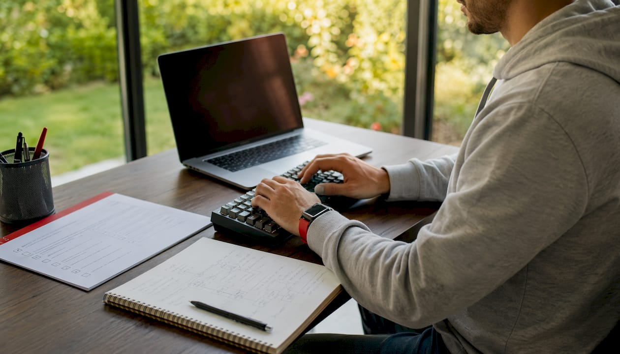 Hands typing code for payment gateway integration