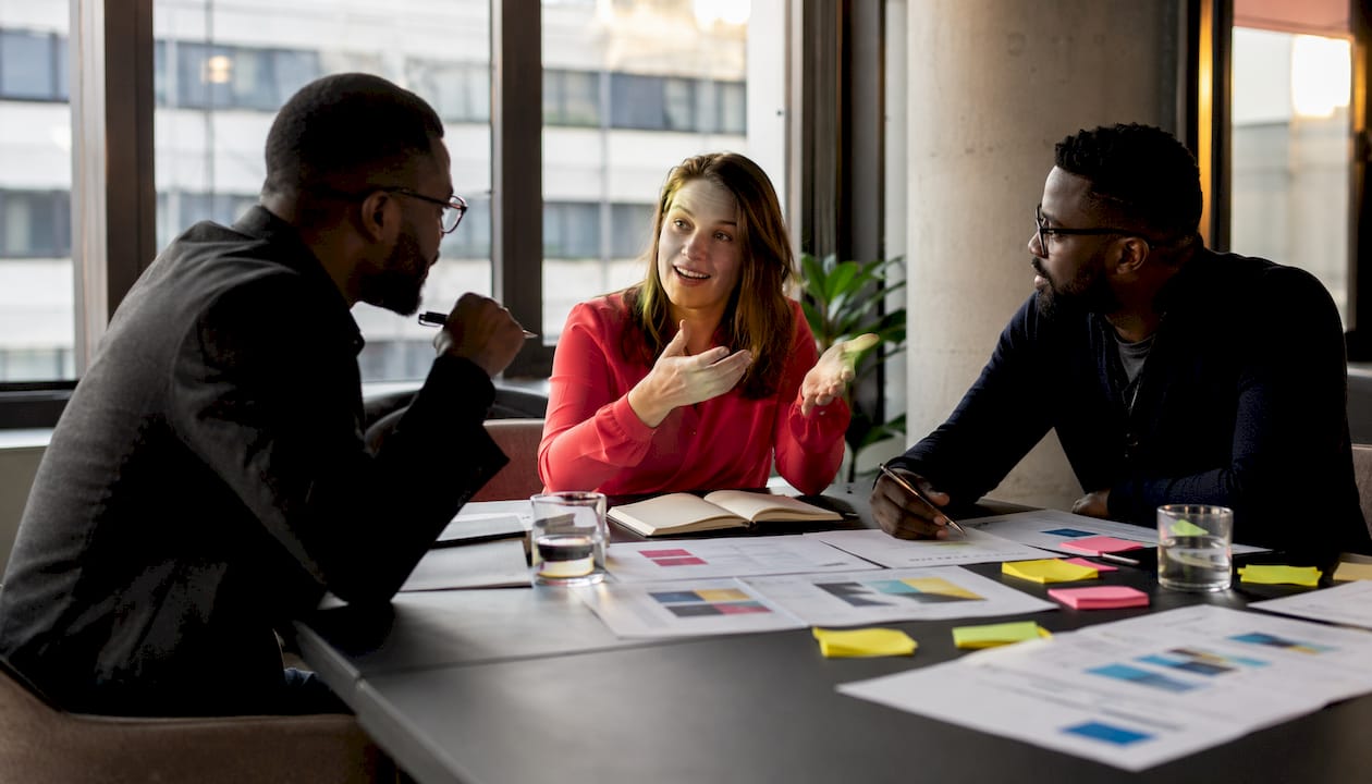 Collaborative team discussing modular tech stack