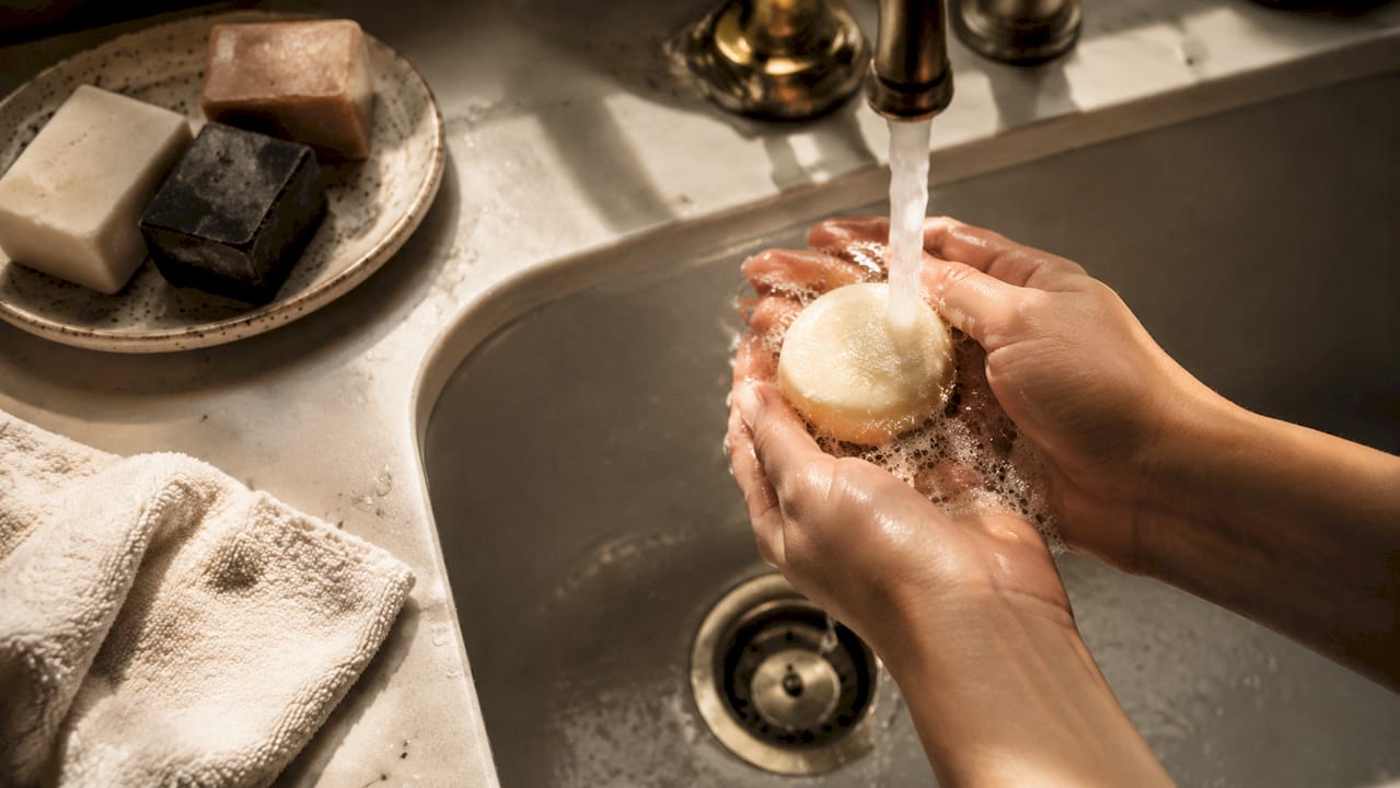 Close-up of hands lathering natural face soap