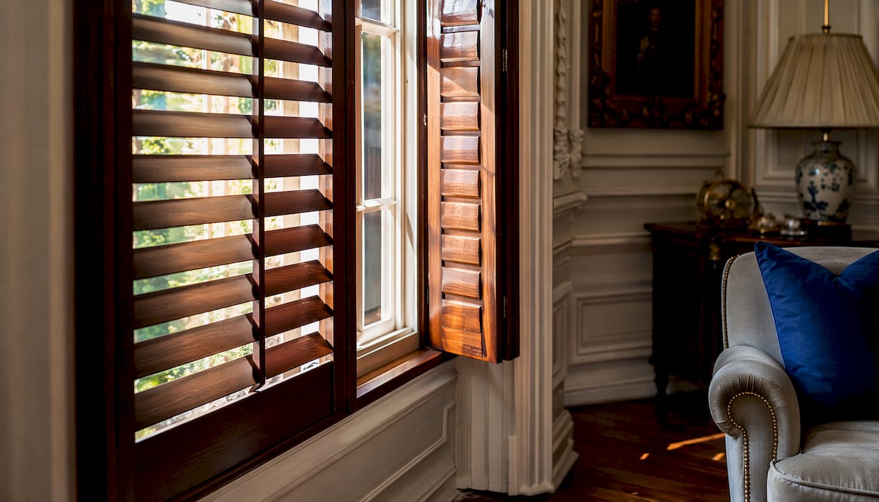 noise reduction window treatments Close-up of hardwood shutter detail