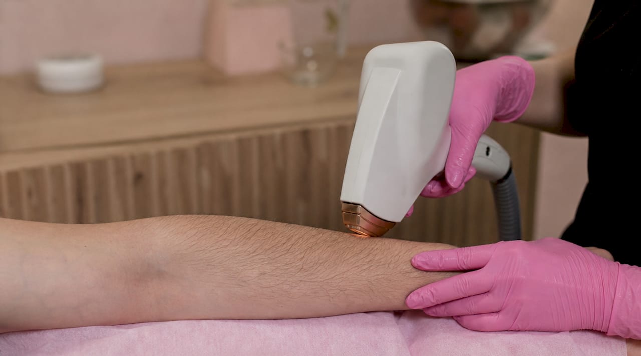 Close-up of laser device targeting hair and skin contrast