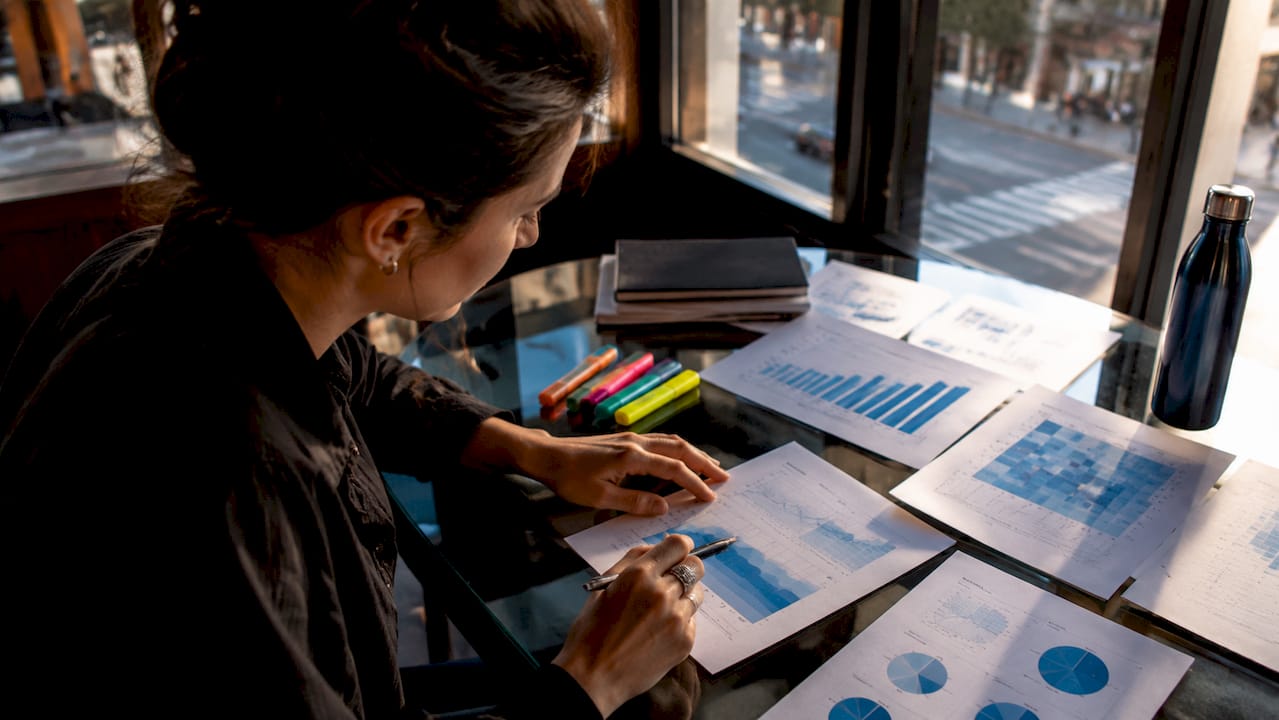 Technician calculating energy modeling data