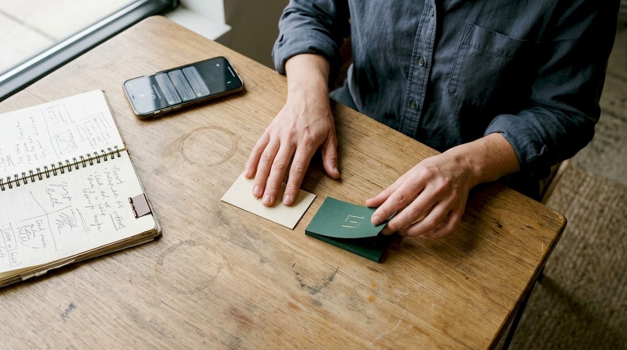 Hands comparing premium textured business cards