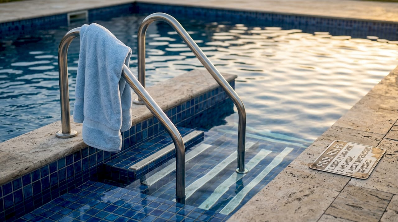 Pool steps with dual safety handrails