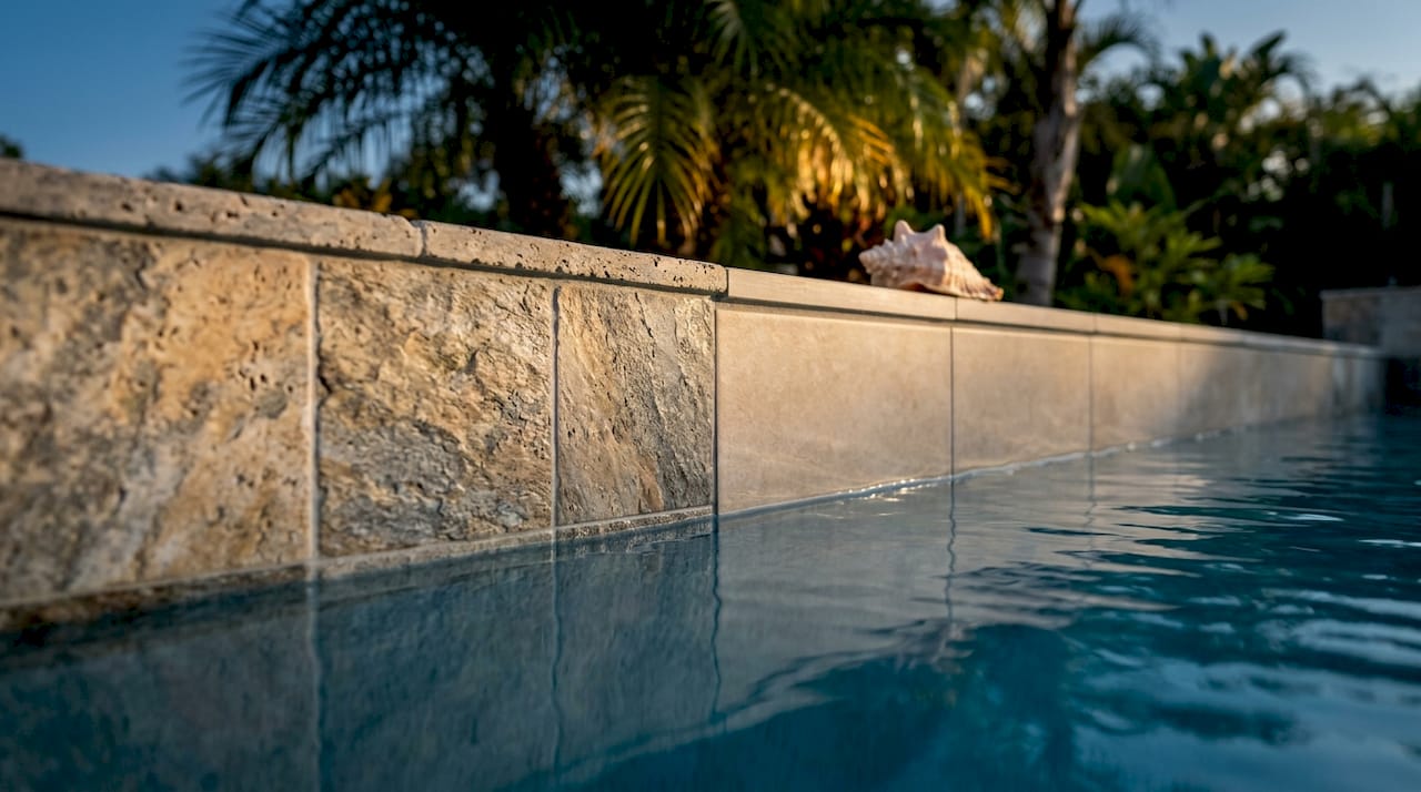 Natural stone and porcelain pool tiles close-up detail