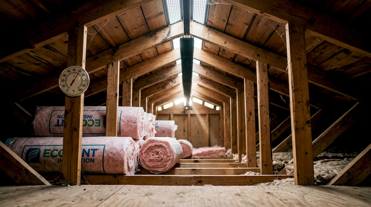 Interior attic showing ventilation and insulation setup