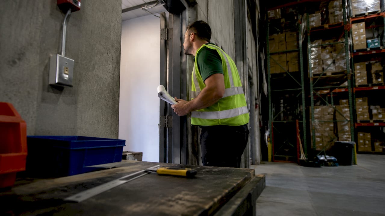 Hands holding fire door inspection checklist