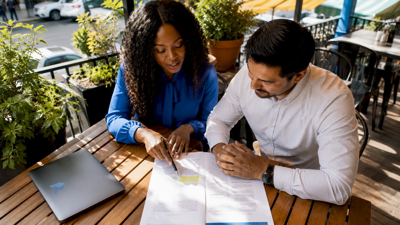 Two contractors discussing roofing exclusivity agreement