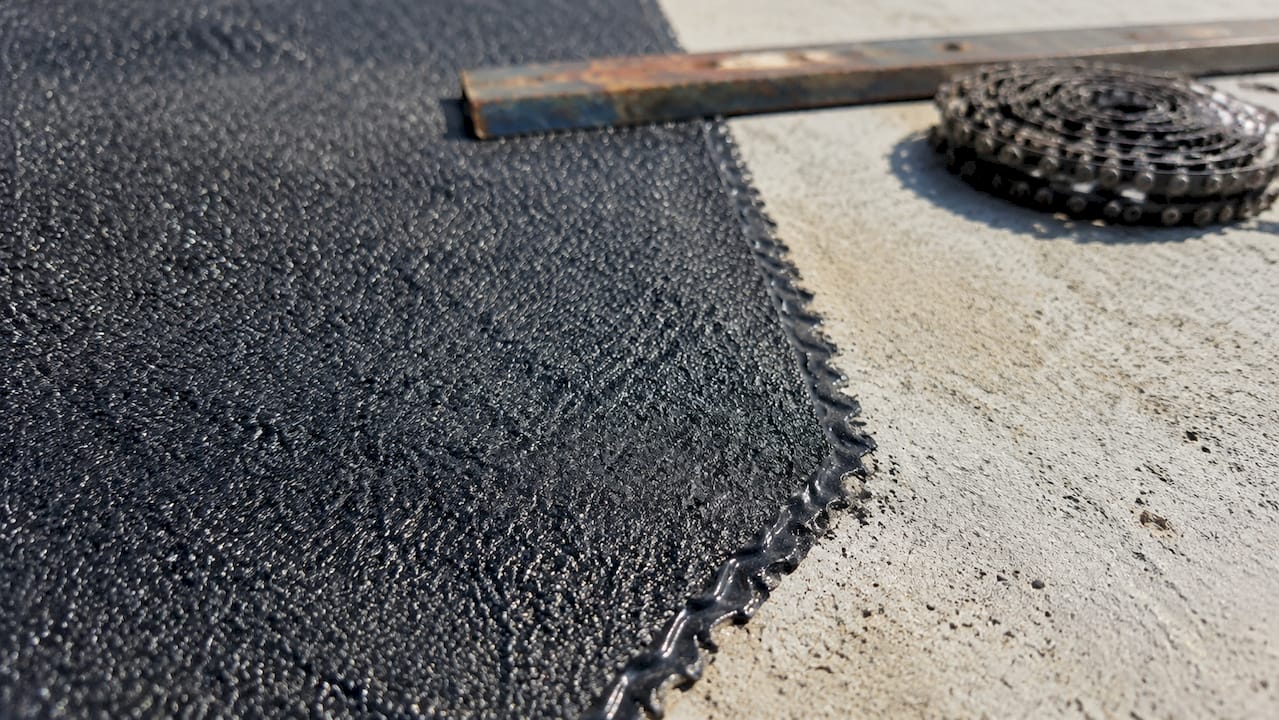 Close-up of ice shield membrane on plywood roof deck