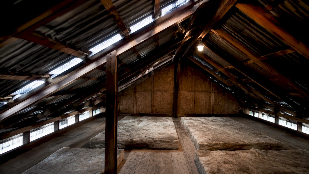 Well-ventilated attic with metal roofing and ridge vent