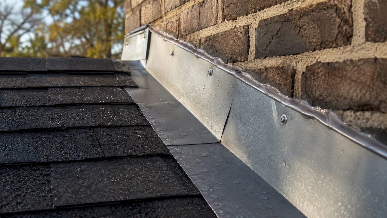 Close-up of metal flashing on roof intersection