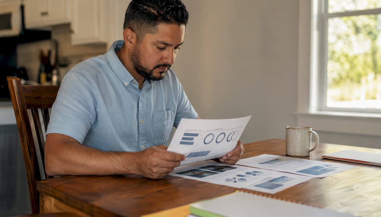 Pool contractor reviewing marketing strategy documents
