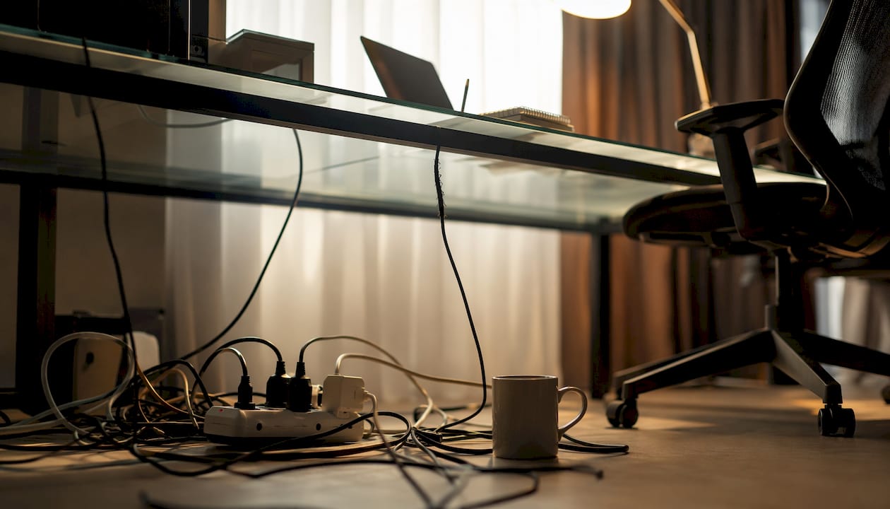 Overloaded power strip in office cubicle