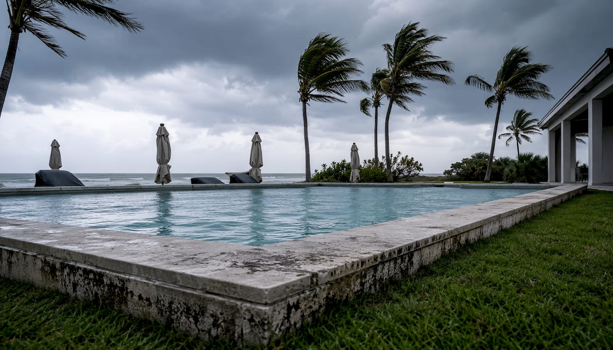 Hurricane Impact on Pools Florida: Prep and Recovery Guide 1 Aerial view of full pool maintaining stability