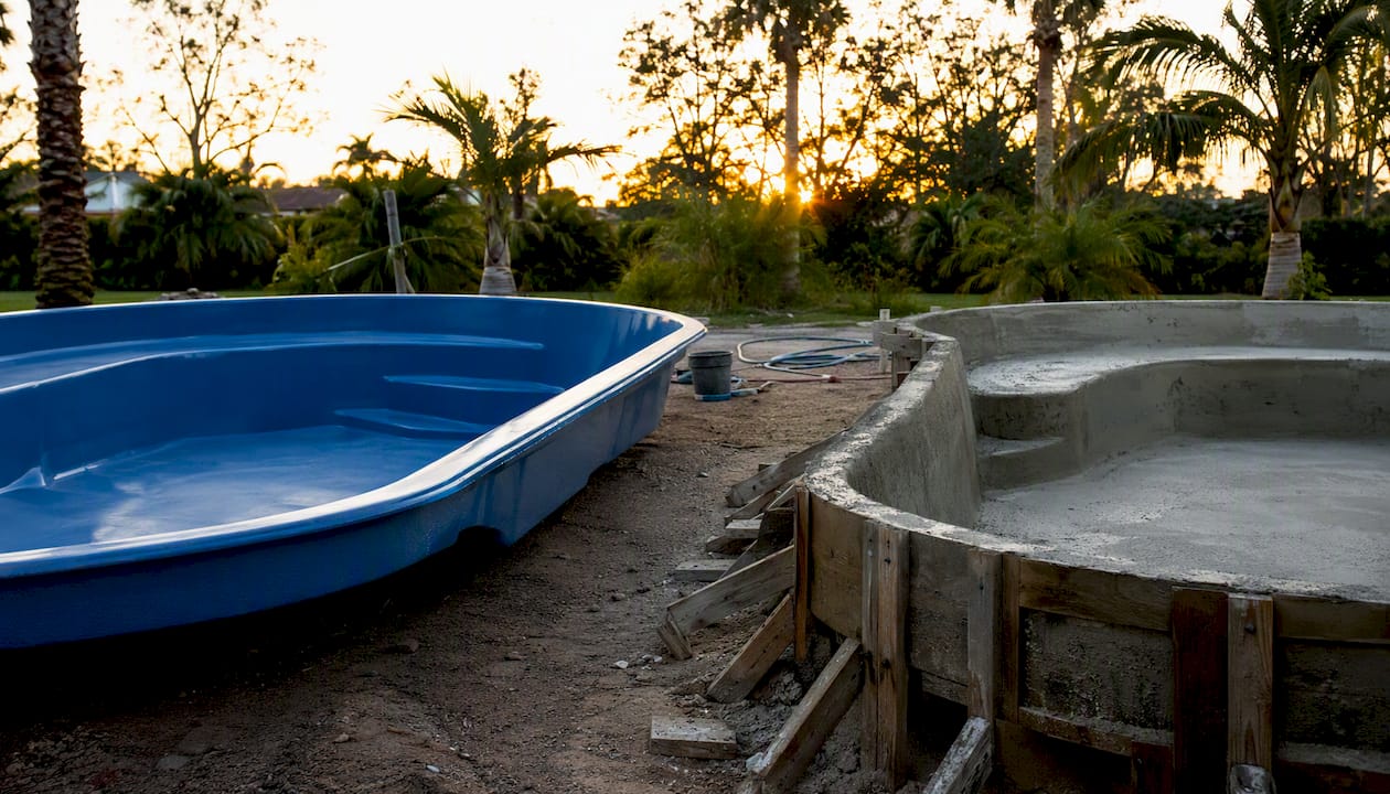 Best spacecoastpoolbuilders.com Alternatives in Central Florida 2 Fiberglass and concrete pool shells side by side