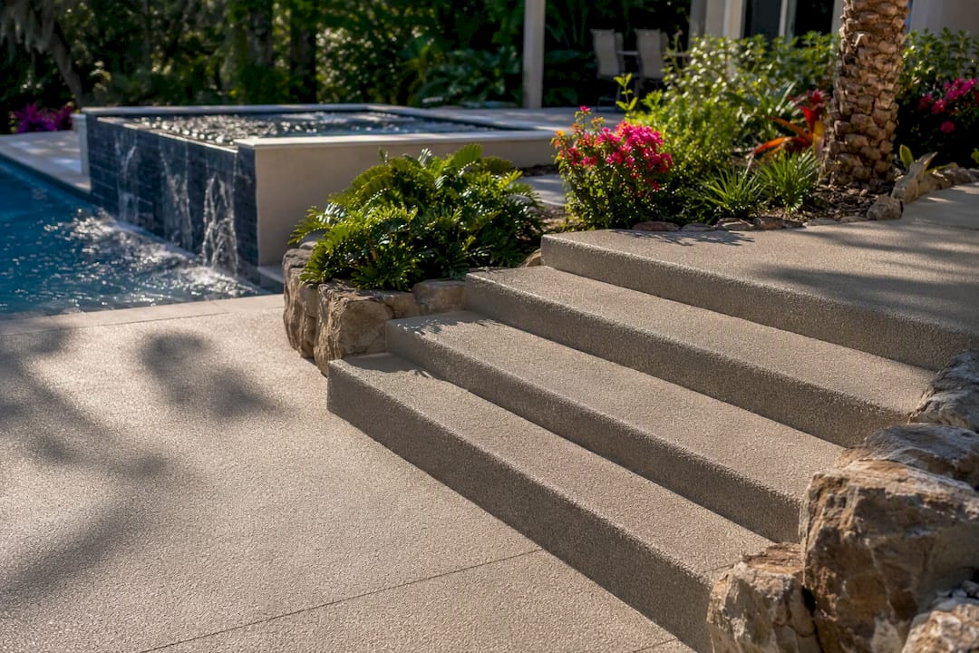 Slip-resistant pool deck and wide textured steps