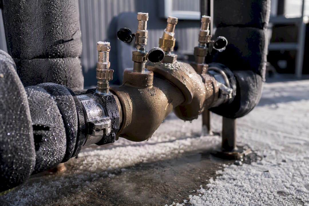 Backflow preventer test cocks open with frost