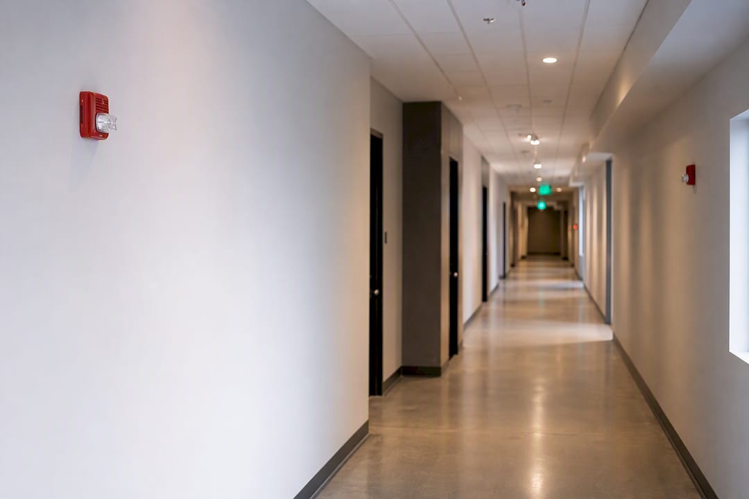 Fire alarm strobes alternating on corridor walls
