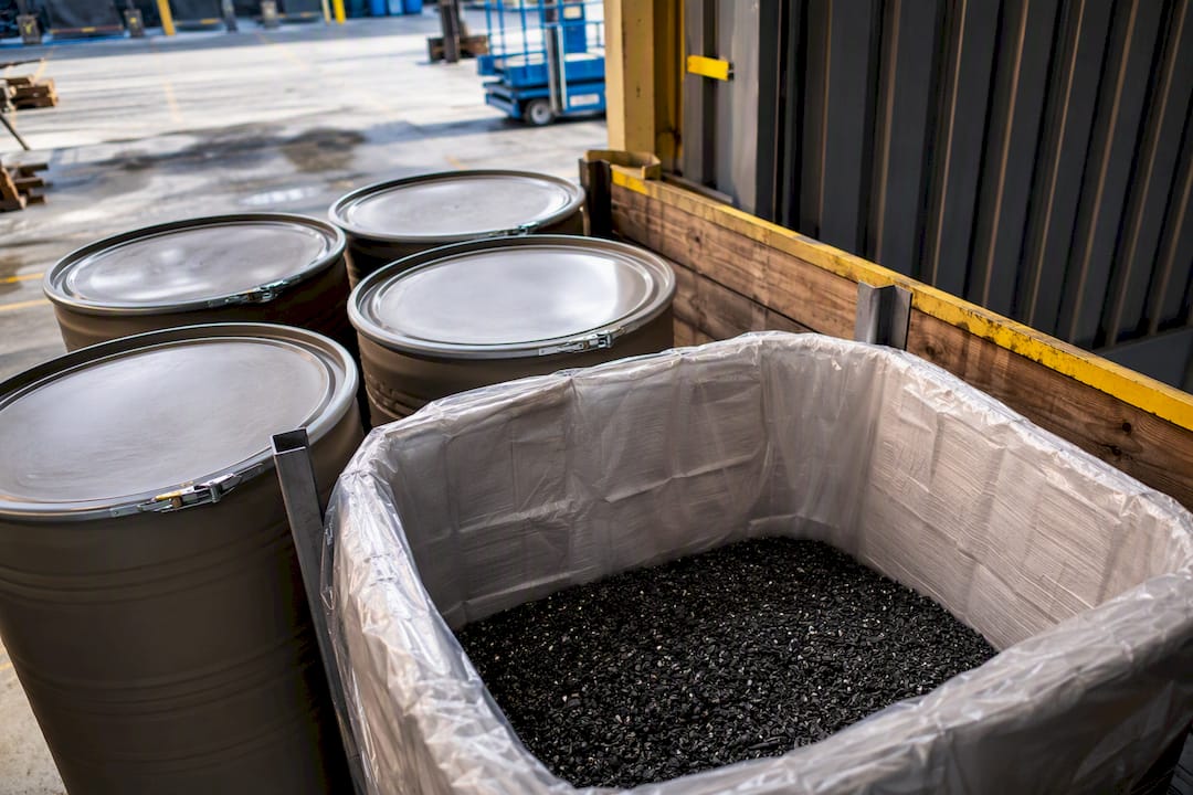 Contained spent abrasive media awaiting disposal