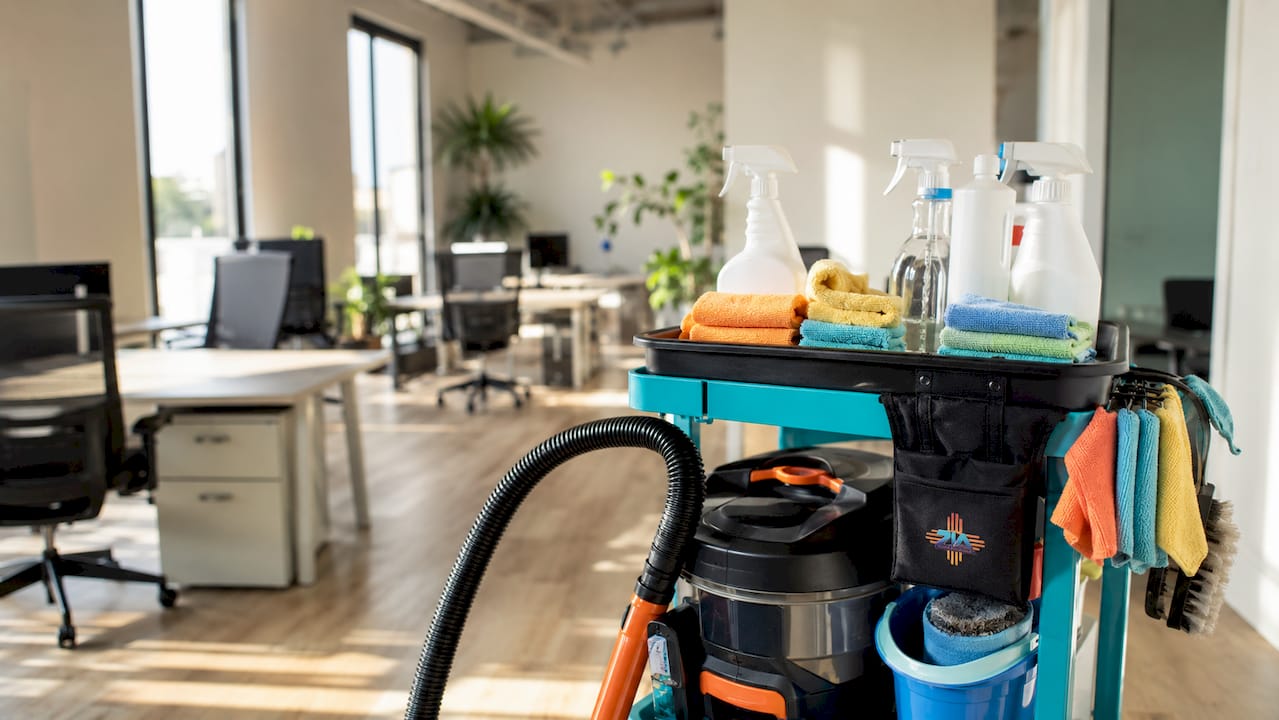 Overhead view of cleaning supplies cart in office hallway