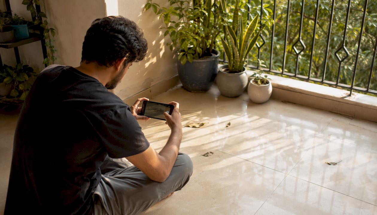Man photographing cleaned floor at home