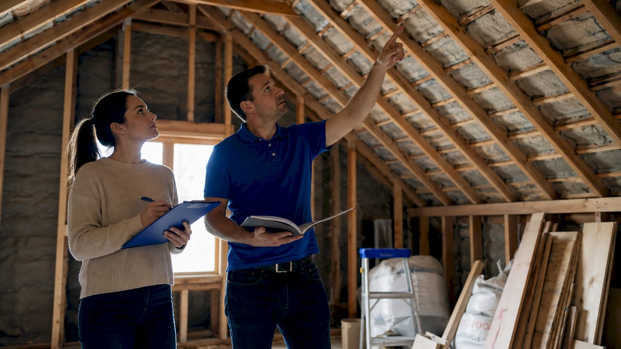 Homebuyer attending basement inspection with inspector