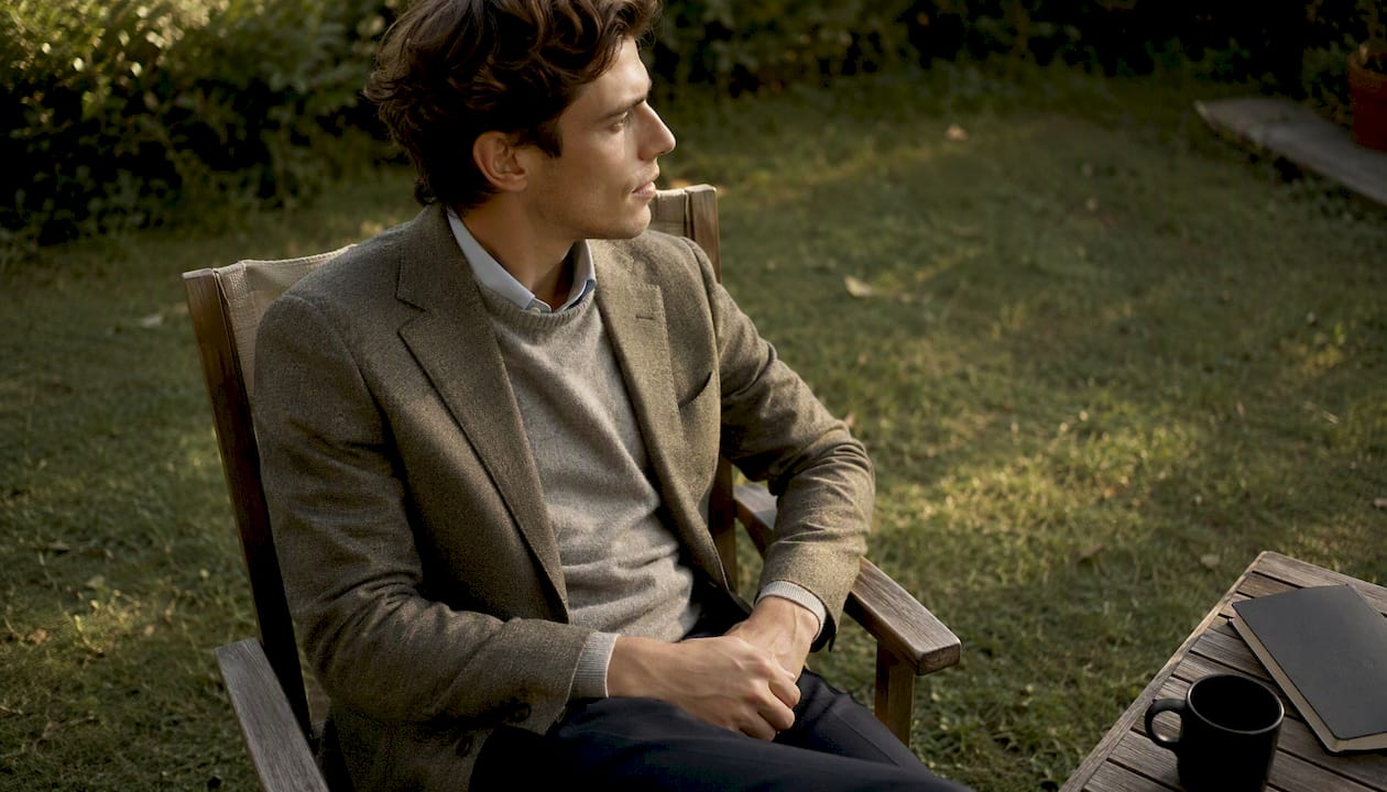 Layered merino wool turtleneck under blazer