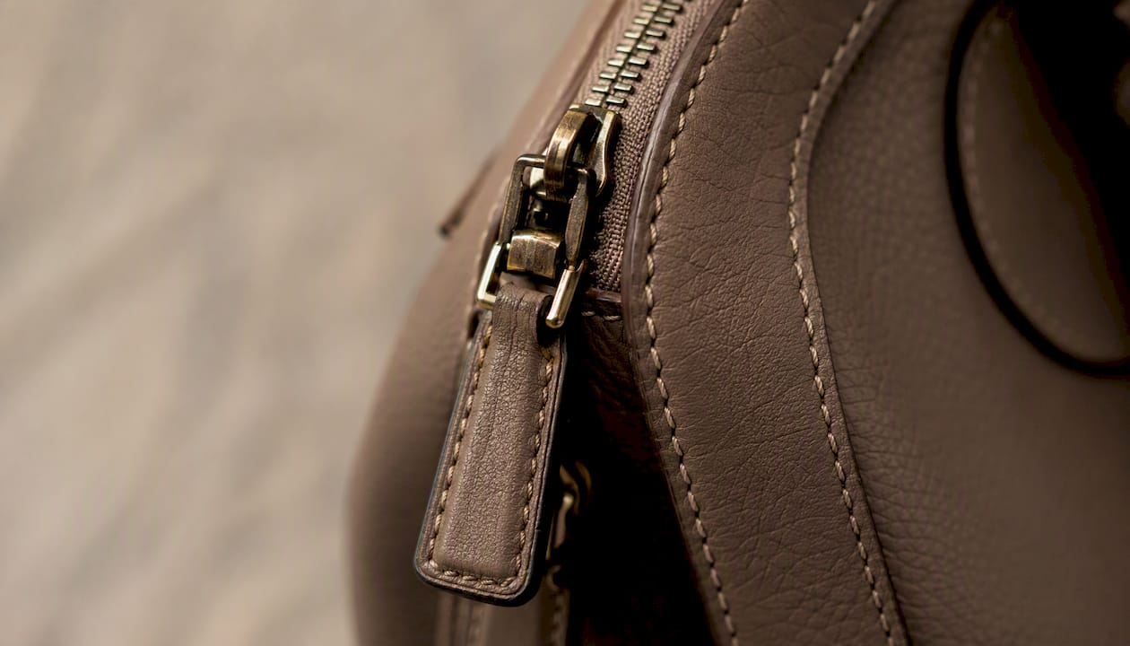 Close-up of luxury bag clasp and stitching detail
