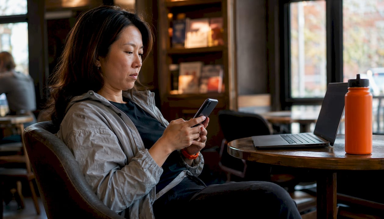 Traveler configuring smartphone before trip