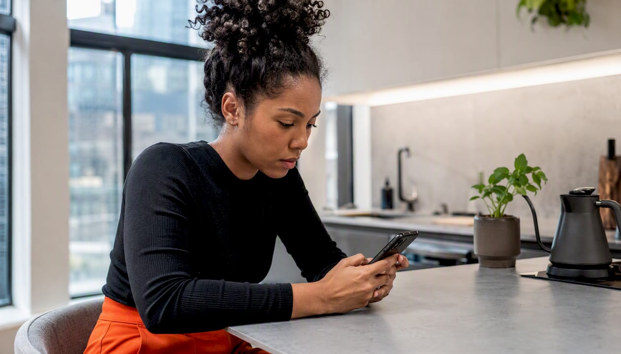 Woman troubleshooting eSIM on iPhone