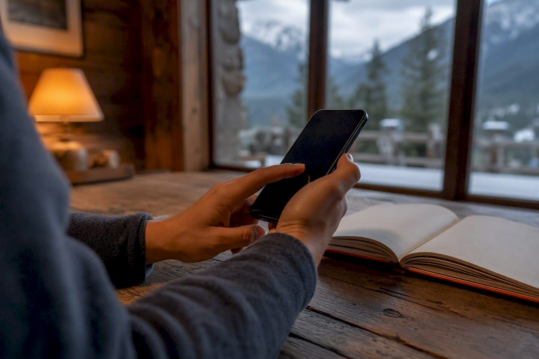 Hands turning on smartphone hotspot in hotel room