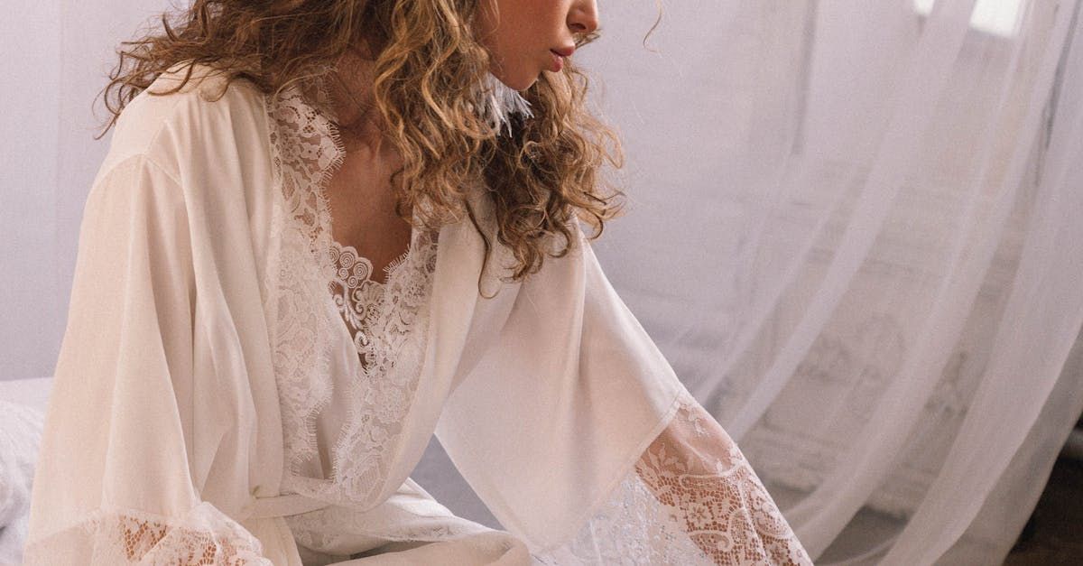 Woman layering textured robe over silk kimono