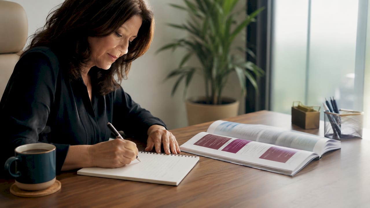 Woman preparing notes for counseling booking