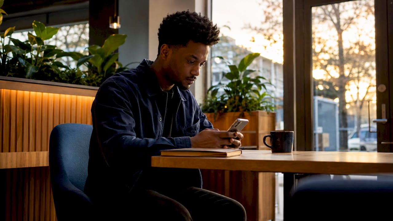 Man scheduling counseling appointment on kiosk