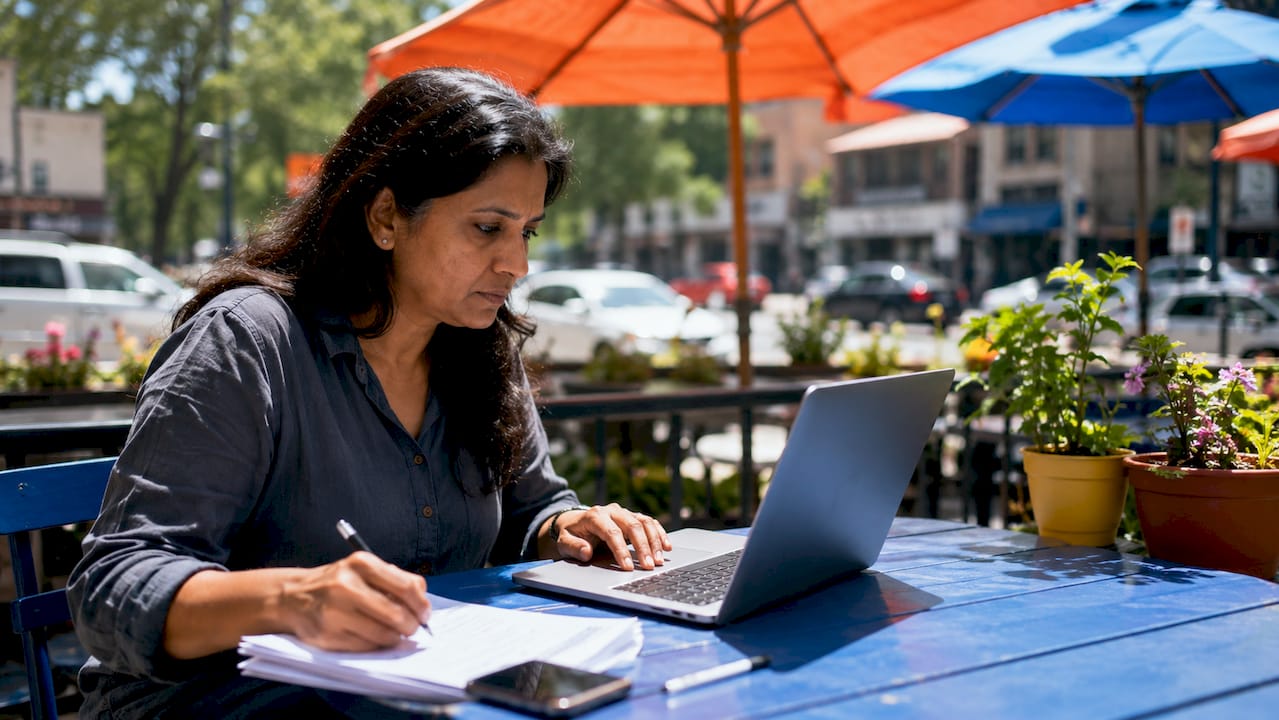 Small business owner typing responses to reviews at home office