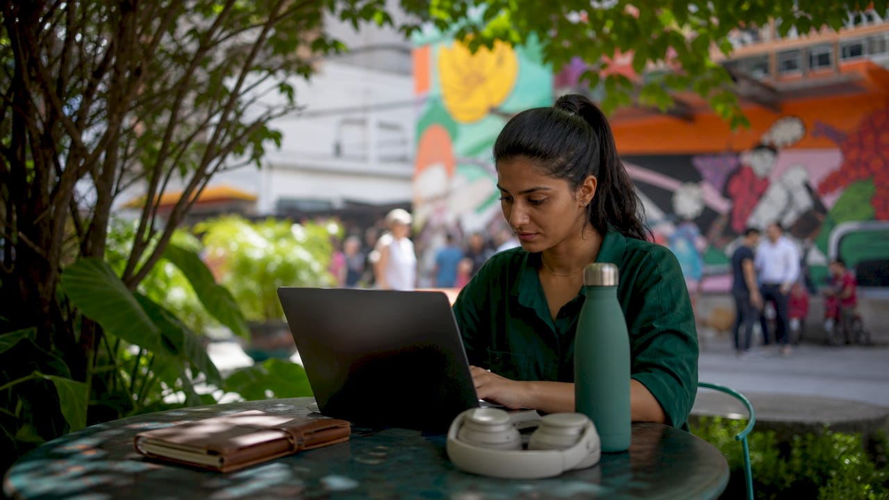 Woman working in digital nomad coliving space