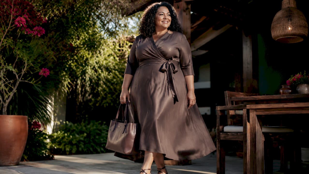 Plus-size woman modeling sustainable wrap dress