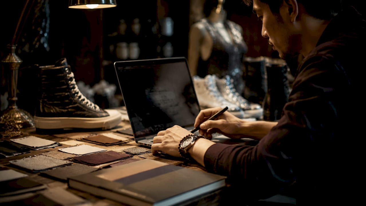 Customer interacting with custom shoe design software