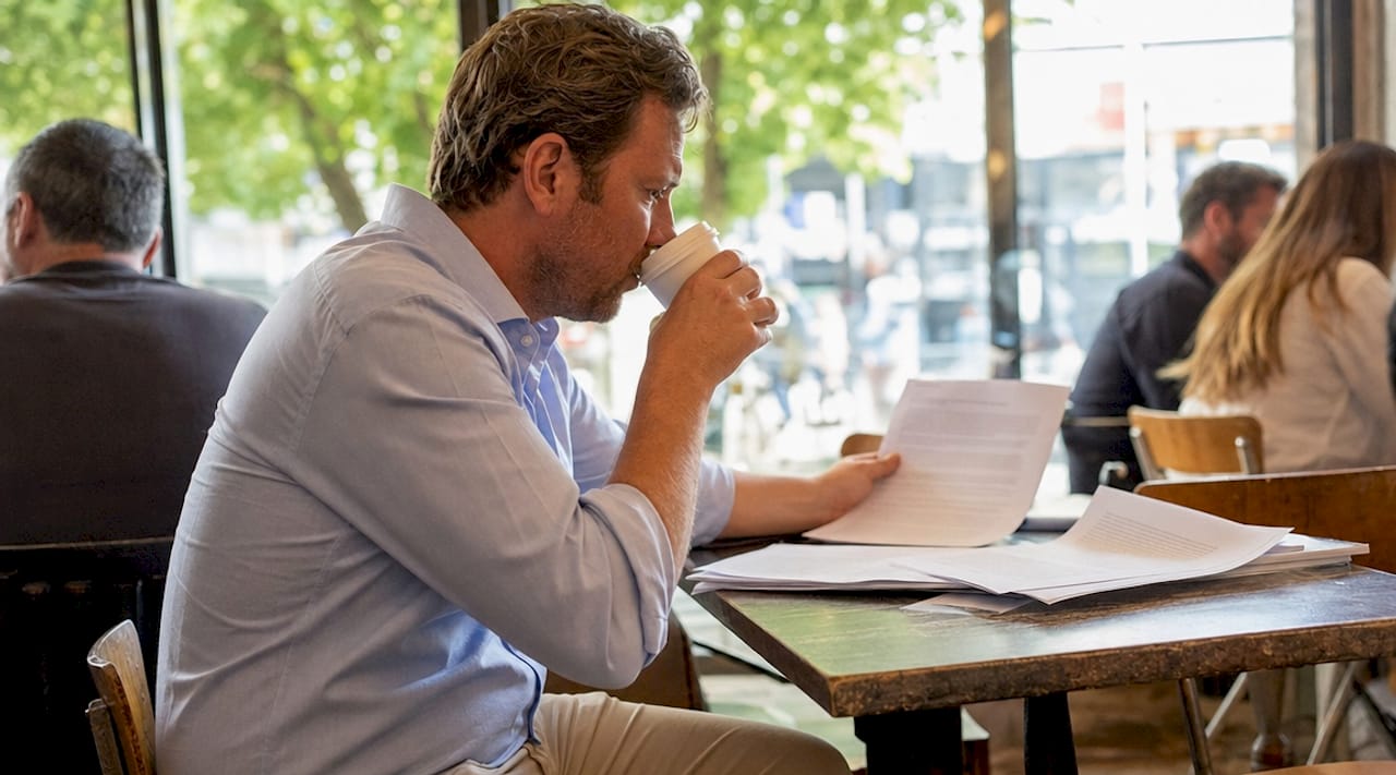 Property developer reviewing funding contract papers