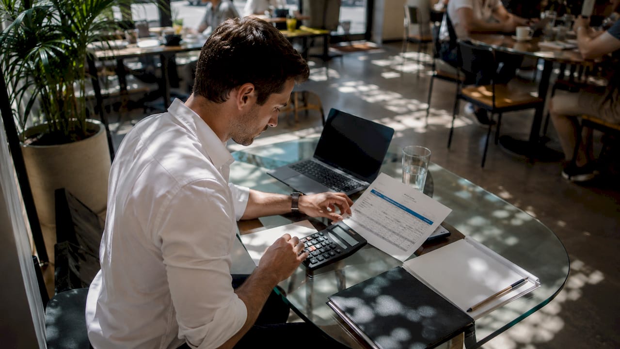 Financial advisor calculating loan to value ratio