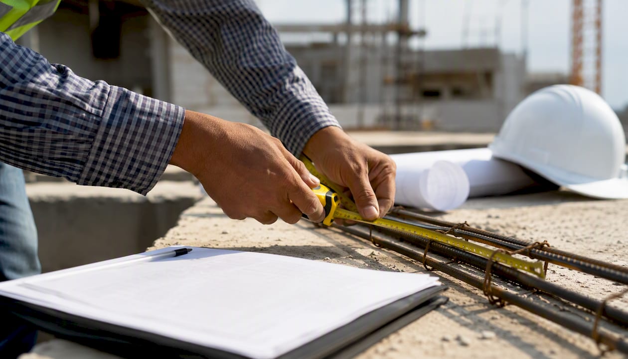 Developer hands measuring on construction site