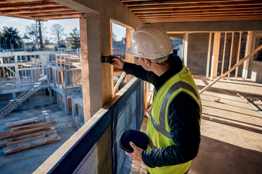 Surveyor inspecting an active property development