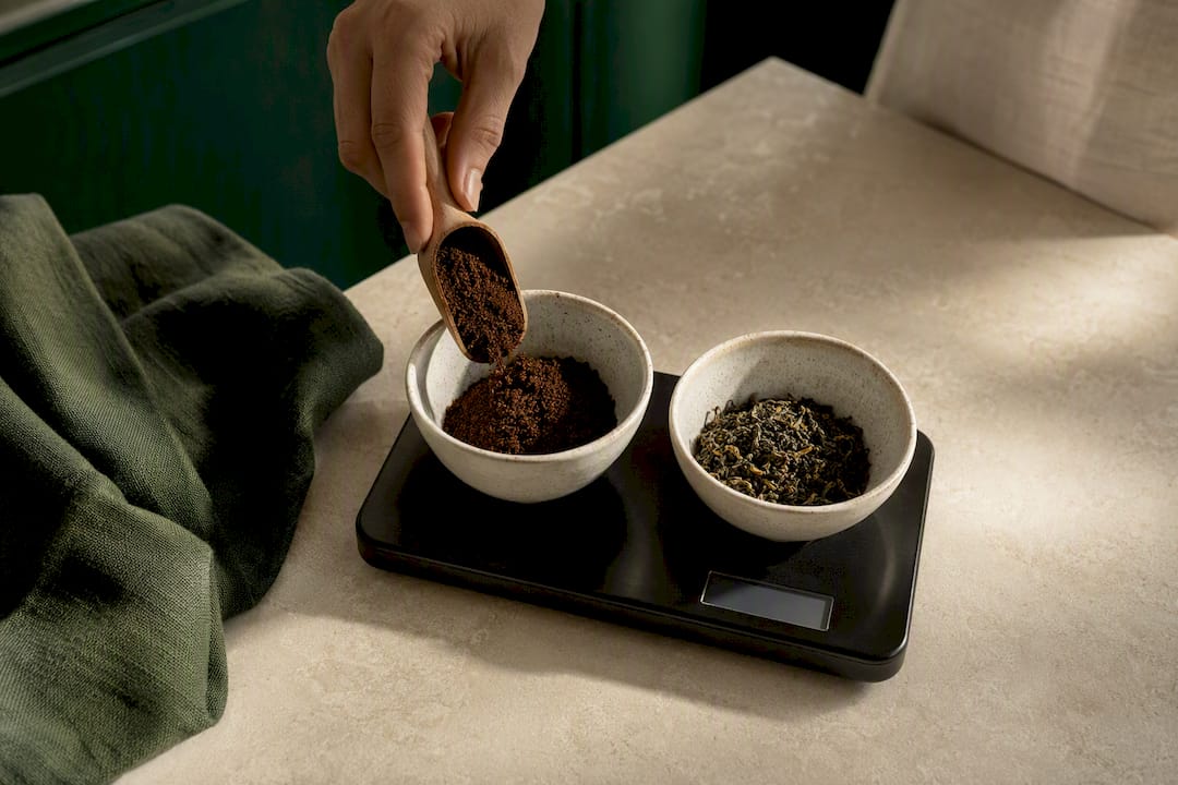 Coffee grounds and tea leaves being weighed