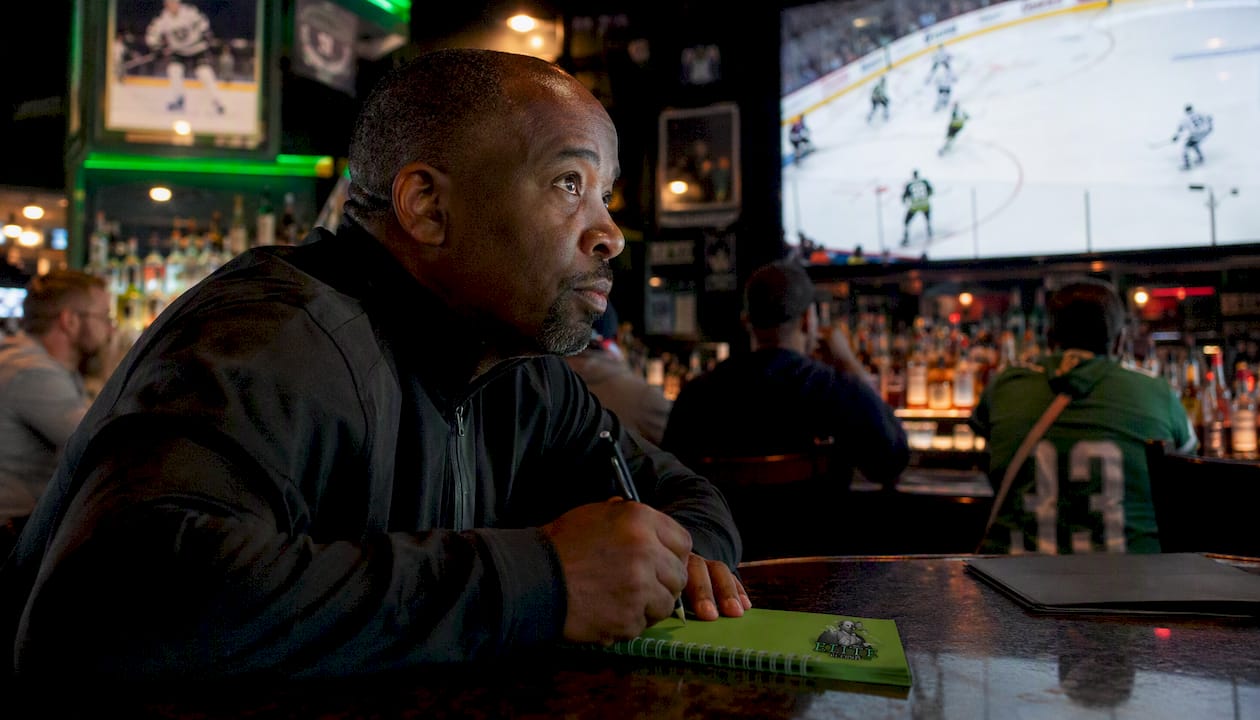 Analyst notes hockey game plays in broadcast booth