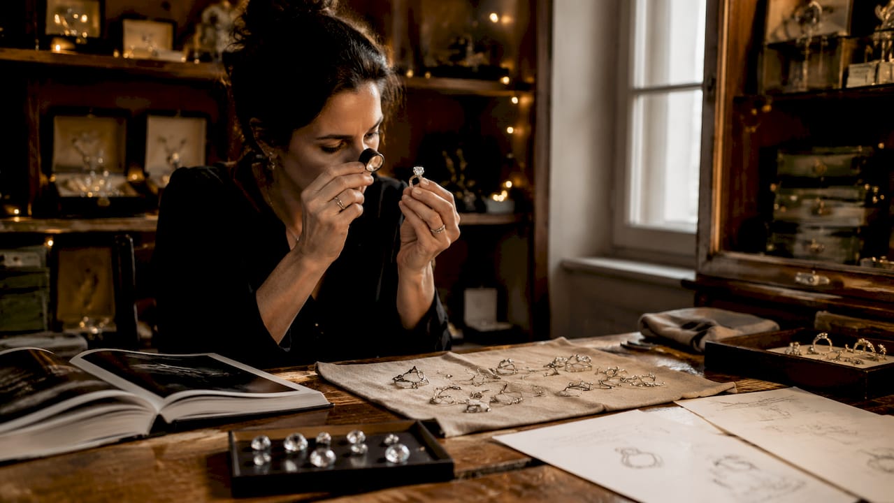 Jeweler examining diamond ring quality closely
