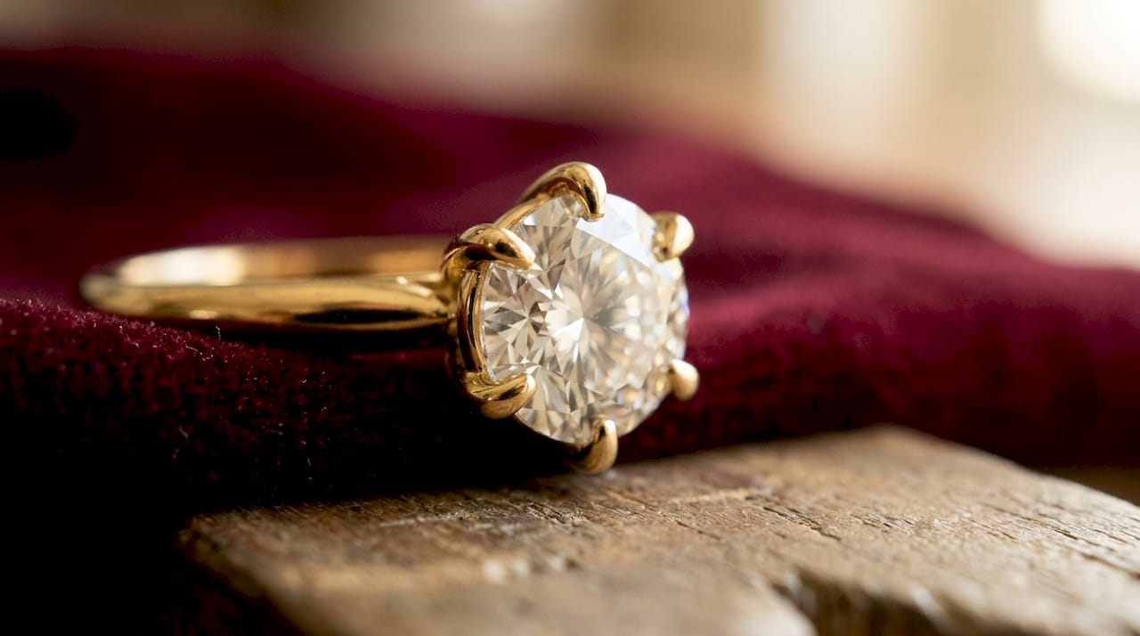Close-up macro view of diamond held by platinum prongs