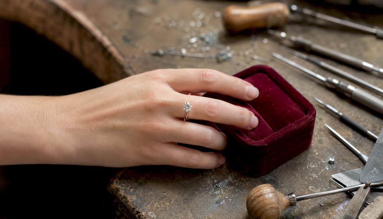 Close-up of platinum engagement ring on hand